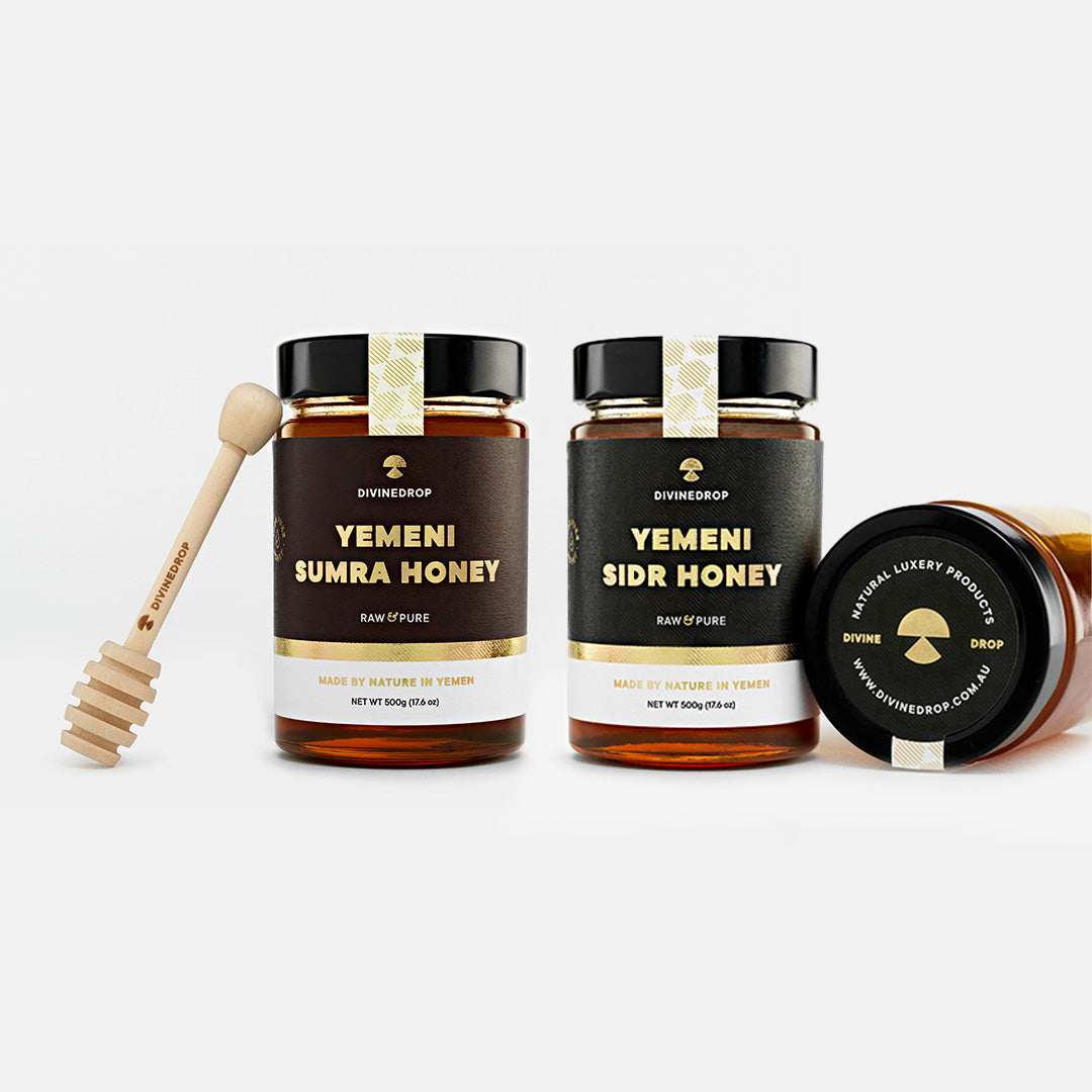 Yemeni Sumra Honey and Yemeni Sidr Honey – 500g Jars with Wooden Honey Dipper and Lid Displayed.